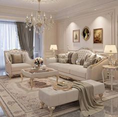 a living room filled with furniture and a chandelier