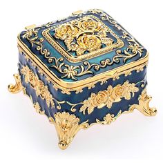 an ornately decorated blue and gold jewelry box on a white background with clipping for text