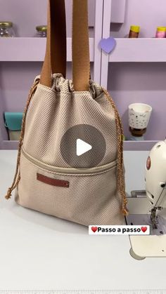 a purse sitting on top of a table next to a sewing machine