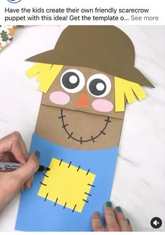 someone is making a scarecrow out of paper