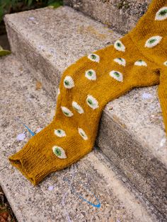 a pair of yellow socks sitting on top of cement steps