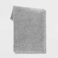 a gray knitted scarf on a white background