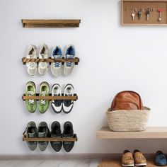 there are many pairs of shoes hanging on the wall