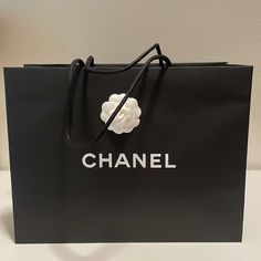 New Chanel Paper Bag (2022 Version). With One While Classic Camellia Taped On One Side. Brand New From The Chanel Boutique. Chanel Paper Purse Template, Channel Shopping Bags, Chanel Paper Bag, Chanel Chip Bag, Coco Chanel Gift Bags, Chanel Mini Shopping Bag, Chanel Black And White, Print On Paper Bags, Chanel Boutique