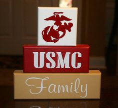 the u s m c family blocks are stacked on top of each other