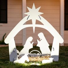 a nativity scene with the birth of jesus and baby jesus in a manger