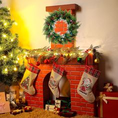 a christmas fireplace with stockings and presents around it