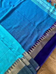 Beautiful Handloom Saree different shades of Ocean Colors (Blue) with Temple Borders Saree in Pure Khaadi. Item : Saree Color : Blue Base Fabric : Pure Khaadi Handloom Blouse piece : Comes with un-stitched Blouse piece. Blouse material : Pure Khaadi Handloom Work : Handloom Saree Fall & Edging : Comes with Fall and edging (Pico) done and Tassels attached Kindly note : Since this Saree is handmade hence little inconsistencies may be there however it is not considered as a defect. Every Saree Blue Slub Silk Traditional Wear For Festivals, Festive Blue Saree With Unstitched Fit, Blue Cutdana Blouse Piece In Traditional Drape, Blue Blouse Piece With Cutdana In Traditional Drape, Traditional Drape Blue Blouse Piece With Dupatta, Blue Festive Blouse Piece With Pallu, Unstitched Blue Blouse Piece For Festive Occasions, Festive Blue Blouse Piece With Pallu, Blue Chanderi Dupatta For Diwali