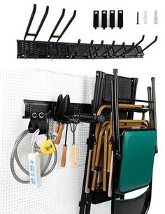 there is a wall mounted rack with many chairs and utensils hanging on it