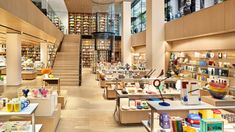 the inside of a store filled with lots of shelves full of books and other items