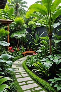 a garden with lots of green plants and trees