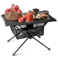 an outdoor picnic table with food on it