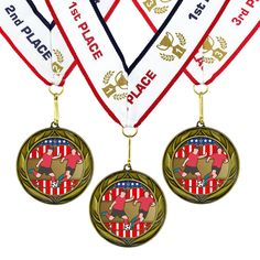 three medals are hanging from the neck of each other, with one medal attached to it's side