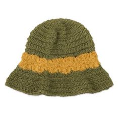 a green and yellow knitted hat on a white background