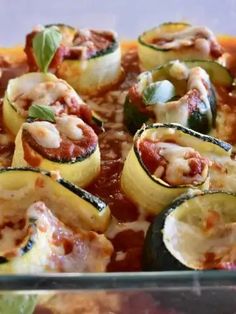 zucchini stuffed with meat and sauce in a casserole dish