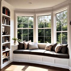 a window seat in the corner of a room with bookshelves on either side