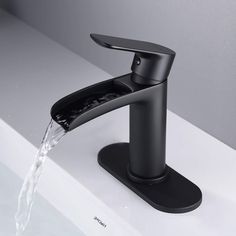 a black faucet with water running from it