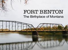 a bridge that is over some water with the words fort benton on top of it