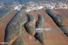 footprints in the sand at the beach