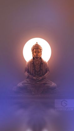 a buddha statue sitting in front of a full moon