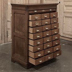 an old wooden cabinet with many drawers