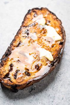 a piece of bread that is sitting on the ground