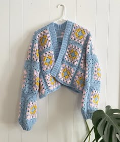 "Cute granny square sweater made out of acrylic yarn. Can be bought in 15\" crop, 23\" regular, and 35\" long. *price due to buyers option to choose any colour they wish! please message us before purchasing to confirm colours." Granny Sweater Outfit, Granny Square Sweater Layout, Crochet Sweater Granny Square, Granny Square Sweater Pattern, Granny Square Sweaters, Crochet Cardigan Granny Square, Crochet Granny Square Sweater, Crochet Granny Square Clothes, Crochet Pattern Bag