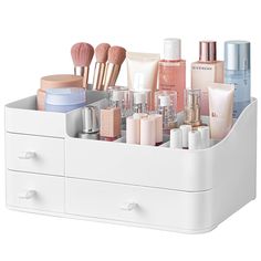 a white drawer with makeup and cosmetics in it