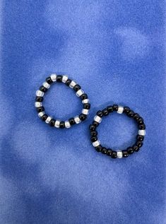 Get two beautiful beaded rings for one!  These rings are elastic so they'll fit you perfectly Black Beaded Rings For Gift, Black Rings With Round Beads As Gifts, Rings Beaded, Homemade Bracelets, Rings Black, Beaded Rings, Black Rings, Rings Statement, Light Purple