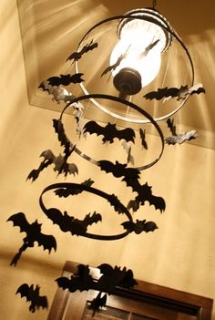 a chandelier with bats hanging from it