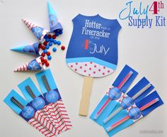 a table topped with lots of blue and red paper fans next to candy sticks on top of each other