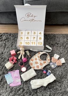 Personalised Mum and Baby Advent Calendar gift box  Filled with 12 handpicked gifts for Mum to be and baby.  Includes a magnetic gift box with bow closure, and 12 cardboard numbered boxes (7.5cm x 7.5cm) The gifts may include (exact items may vary unless specifically requested): Bump mask Bump oil Face mask Candle Essential relaxation oils Mum and Dad decision coin  Baby comforter Baby bib Baby bubble bath   Baby socks Baby muslin  Mini plush  Includes name on front of the box, and wording on inside to suit (baby countdown will be used if not stated otherwise) Colours of writing (will come gold as standard unless requested otherwise): Gold Black Red Blue Green Pink Metallic silver Metallic rose gold Baby Advent Calendar, Baby Countdown, Baby Bubble Bath, Mum And Baby, Calendar Gift, Advent Calendar Gifts, Magnetic Gift Box, Mum To Be, Baby Bubble