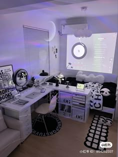 a room with a desk, chair and computer monitor on the wall in front of it