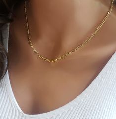 Gold plated figaro layering choker! This classy chain can be a standout necklace on its own or a great addition to other necklaces. The links give it a statement look when you wear it with other chains. It's made from 14K gold plated with a waterproof coating so it's safe for sensitive skin. This necklace is perfect for everyday wear, with its classic yellow gold color. IT'S IN THE DETAILS ✦ High Quality 14K Gold Plated Figaro Chain with waterproof coating ✦ Shown at 18" - WHY YOU'LL LOVE IT * B Dainty Chain Necklace, Figaro Necklace, Yellow Gold Color, Figaro Chain Necklace, Layered Chokers, Sandwich Bags, Necklace Layering, Dainty Chain, Figaro Chains