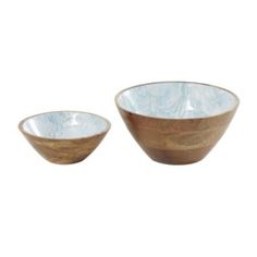 two wooden bowls sitting next to each other