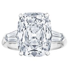 an oval cut diamond ring with baguets on the shoulders