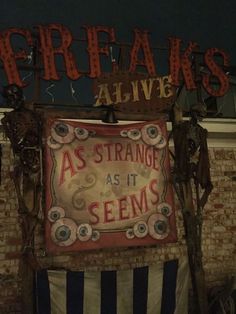 there is a sign that says freakies alive as strange as its sem's