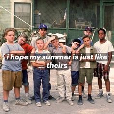 a group of young boys standing next to each other in front of a building with the words i hope my summer is just like their