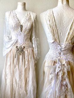 two mannequins dressed in white and beige dresses