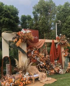 an outdoor ceremony with flowers and decorations