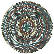 a round rug with multicolored circles on it