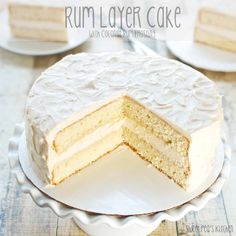 a white cake sitting on top of a plate