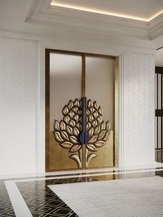 the entrance to an elegantly decorated room with gold and black decorations on the doors