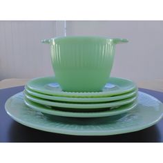 green dishes stacked on top of each other