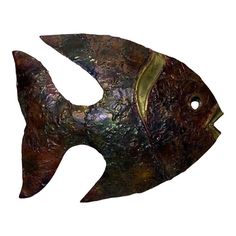 a metal fish with gold accents on it's face and back side, against a white background