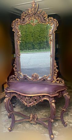 an ornate purple bench with a mirror on it