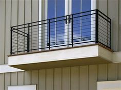 a balcony with railings and balconies on the side of a building