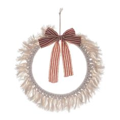 a red and white wreath with a bow hanging from it