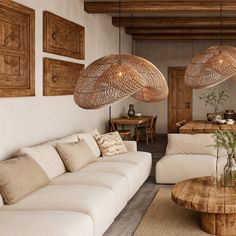 a living room filled with white couches and wooden tables