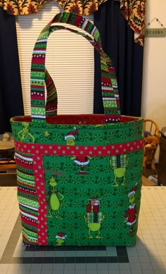 a green and red bag sitting on top of a counter